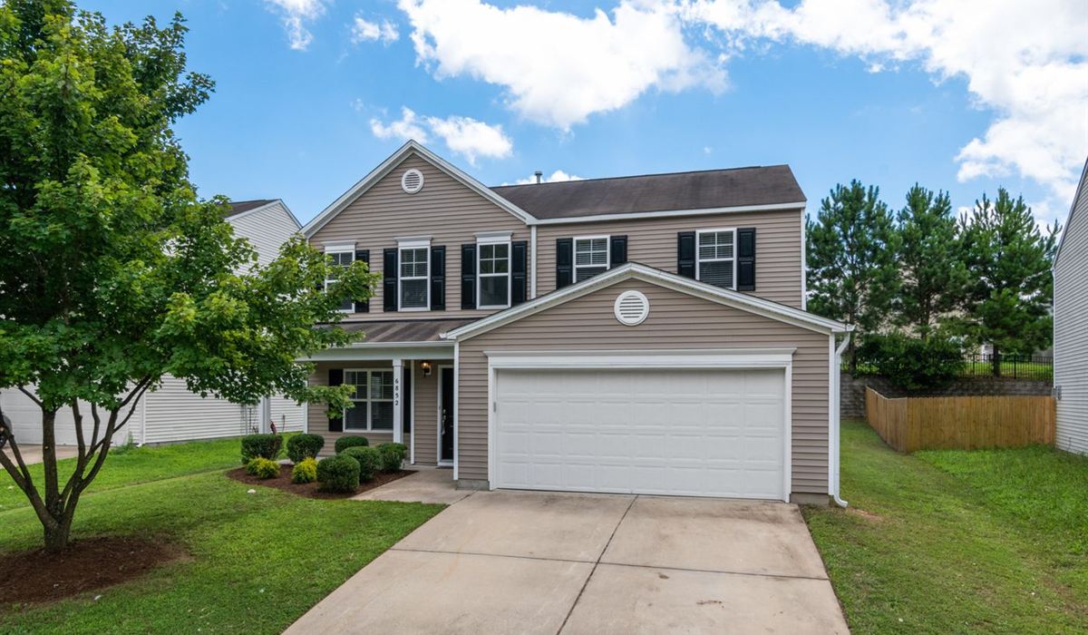 Suburban Pickering home with an attached two-car garage