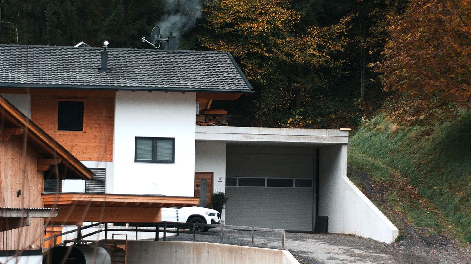 Detached house with an integrated garage on an autumn afternoon