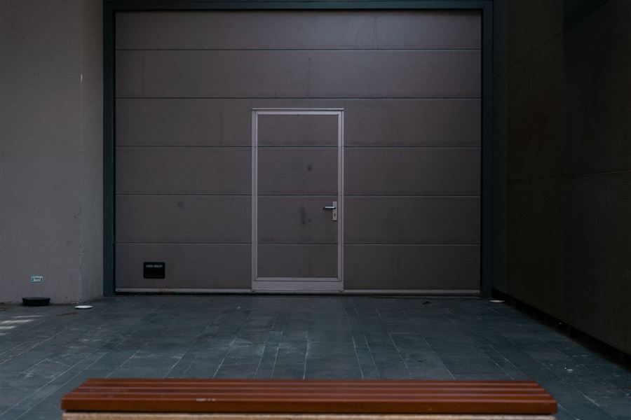 Flush modern garage door in a dark finish