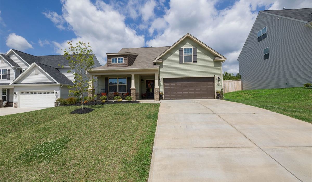 Modern suburban home with a wide brown double garage door